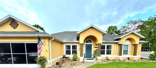 3495 W Wilburton Dr, Citrus Springs, FL 34433 - view of front of home featuring stucco siding and roof with shingles