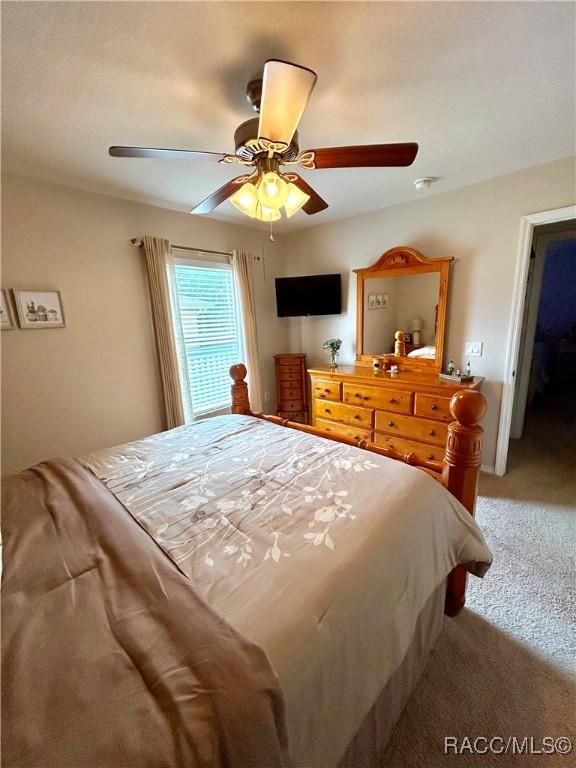 3495 W Wilburton Dr, Citrus Springs, FL 34433 - bedroom with carpet floors and ceiling fan