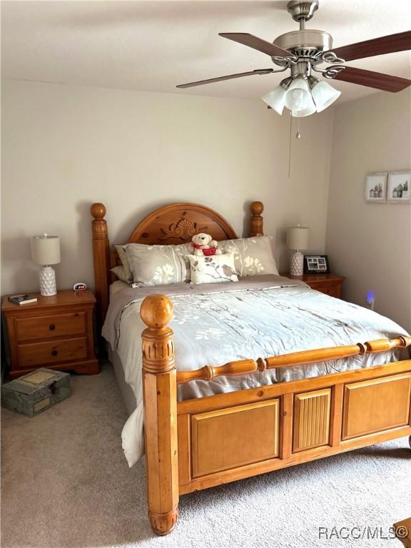 3495 W Wilburton Dr, Citrus Springs, FL 34433 - bedroom featuring light colored carpet