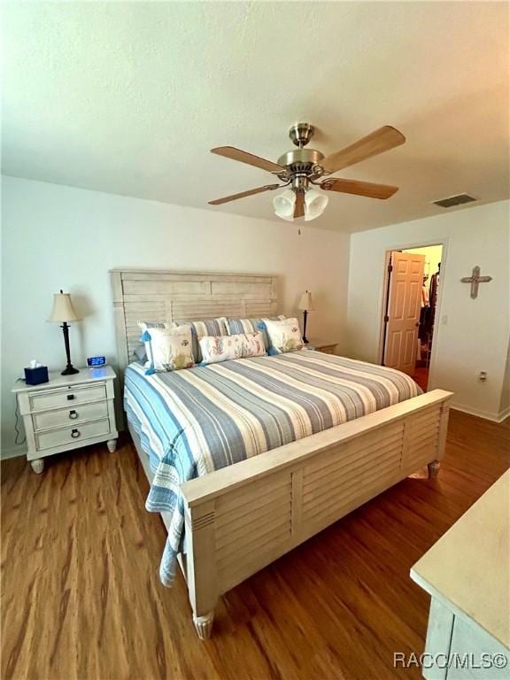 3495 W Wilburton Dr, Citrus Springs, FL 34433 - bedroom featuring wood finished floors and a ceiling fan