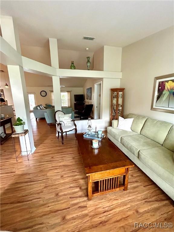 3495 W Wilburton Dr, Citrus Springs, FL 34433 - living area with light wood-style floors and high vaulted ceiling