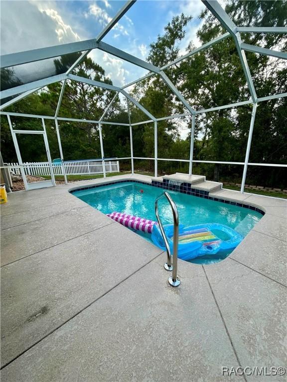 3495 W Wilburton Dr, Citrus Springs, FL 34433 - outdoor pool featuring a patio area and a jacuzzi