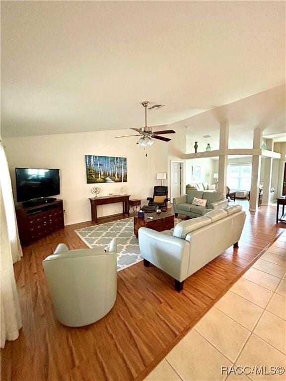 3495 W Wilburton Dr, Citrus Springs, FL 34433 - living room featuring light tile patterned flooring, a ceiling fan, and vaulted ceiling