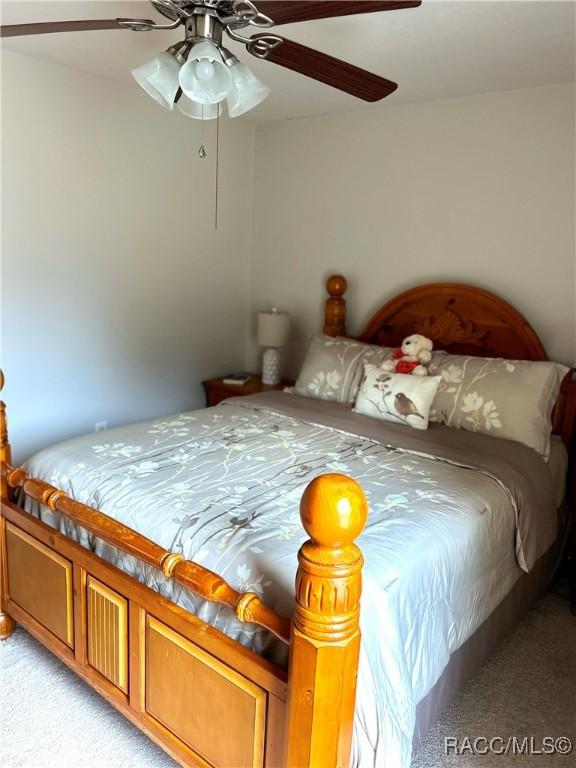 3495 W Wilburton Dr, Citrus Springs, FL 34433 - bedroom featuring light colored carpet and ceiling fan