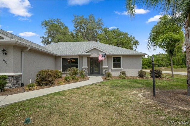 2797 N Hythe Pt, Hernando, FL 34442 - view of front facade with stucco siding, a front yard, and cooling unit