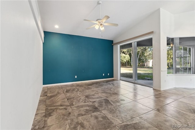 empty room with ceiling fan and lofted ceiling