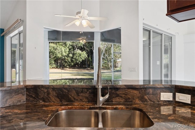 kitchen featuring ceiling fan and sink