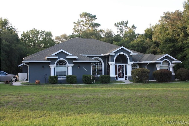 ranch-style house with a front yard