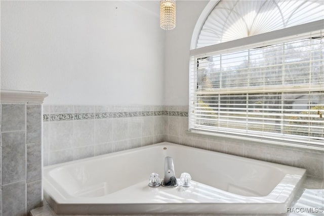 bathroom featuring a tub to relax in