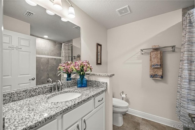 3153 N Chandler Dr, Hernando, FL 34442 - bathroom featuring vanity, a tile shower, and a textured ceiling