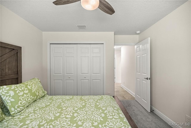 3153 N Chandler Dr, Hernando, FL 34442 - bedroom with a closet, a textured ceiling, carpet flooring, and ceiling fan