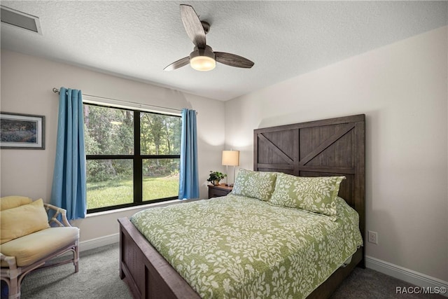 3153 N Chandler Dr, Hernando, FL 34442 - carpeted bedroom with a textured ceiling and ceiling fan