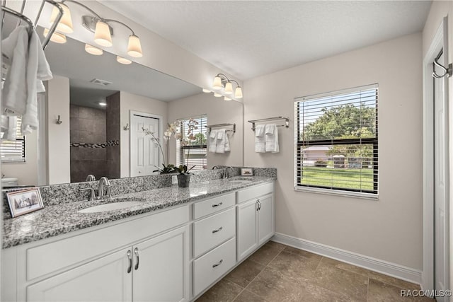 3153 N Chandler Dr, Hernando, FL 34442 - bathroom featuring double vanity and tiled shower