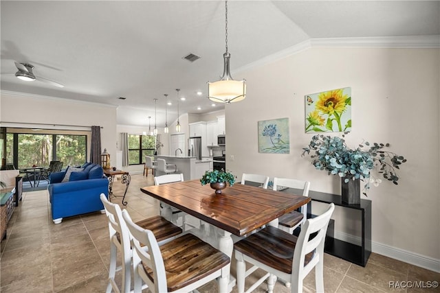 3153 N Chandler Dr, Hernando, FL 34442 - dining room featuring light tile patterned flooring, a ceiling fan, ornamental molding, and vaulted ceiling