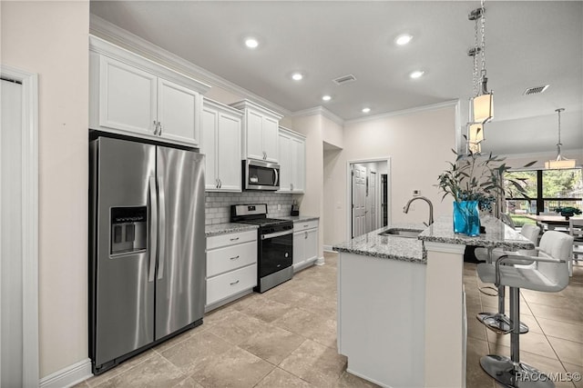 3153 N Chandler Dr, Hernando, FL 34442 - kitchen with appliances with stainless steel finishes, ornamental molding, white cabinetry, decorative backsplash, and light stone counters