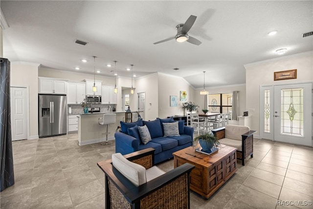 3153 N Chandler Dr, Hernando, FL 34442 - living area with crown molding, ceiling fan, light tile patterned floors, recessed lighting, and vaulted ceiling