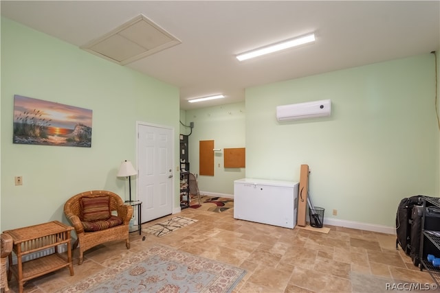 living area with a wall mounted air conditioner