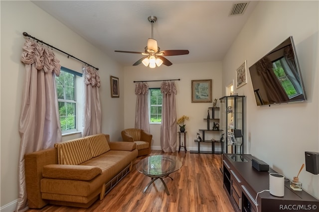 living room featuring hardwood / wood-style flooring and ceiling fan