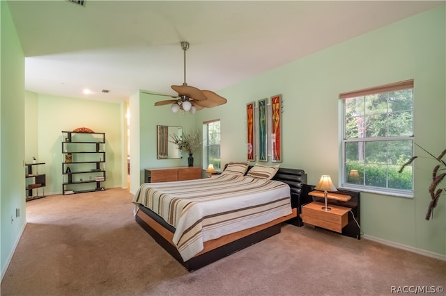 bedroom featuring light colored carpet and ceiling fan