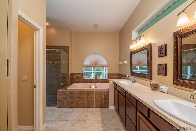 bathroom with vanity, tile patterned floors, and independent shower and bath