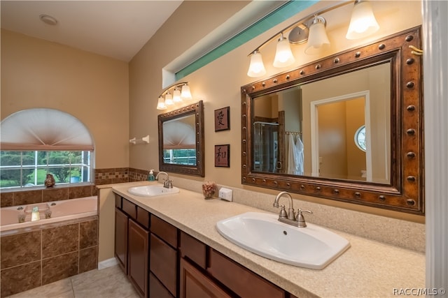 bathroom featuring tile patterned floors, vanity, and independent shower and bath