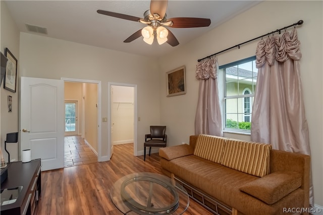 living room featuring a wealth of natural light, hardwood / wood-style floors, and ceiling fan