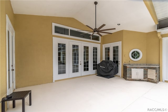 view of patio with area for grilling, ceiling fan, french doors, and sink