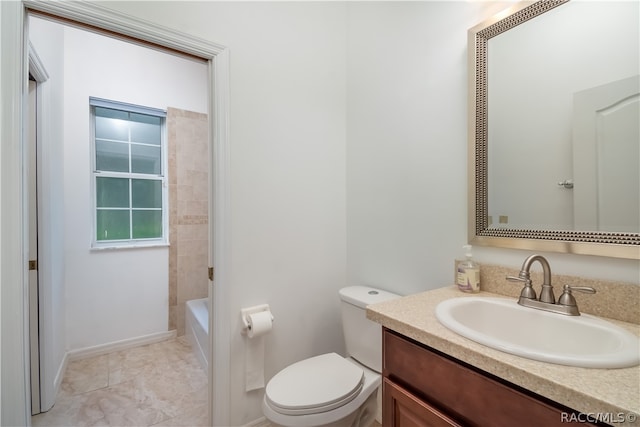 bathroom with tile patterned floors, vanity, and toilet