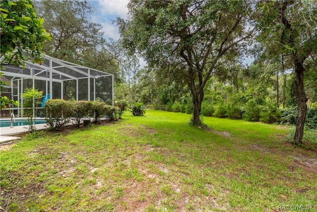 view of yard featuring a lanai