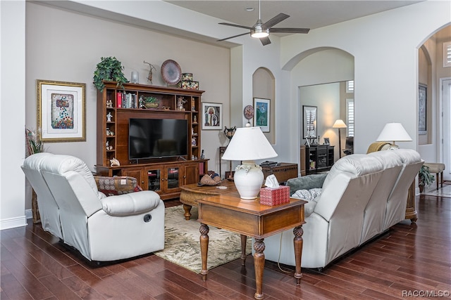 living room with ceiling fan and dark hardwood / wood-style floors