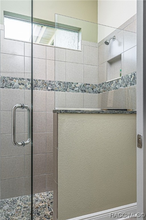 bathroom with walk in shower