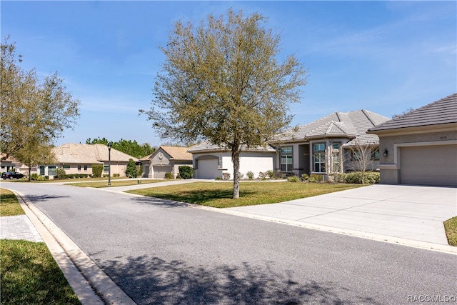 view of front facade featuring a front yard and a garage