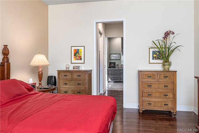 bedroom featuring dark hardwood / wood-style flooring