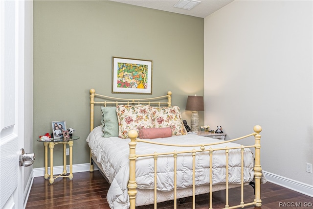 bedroom featuring dark wood-type flooring