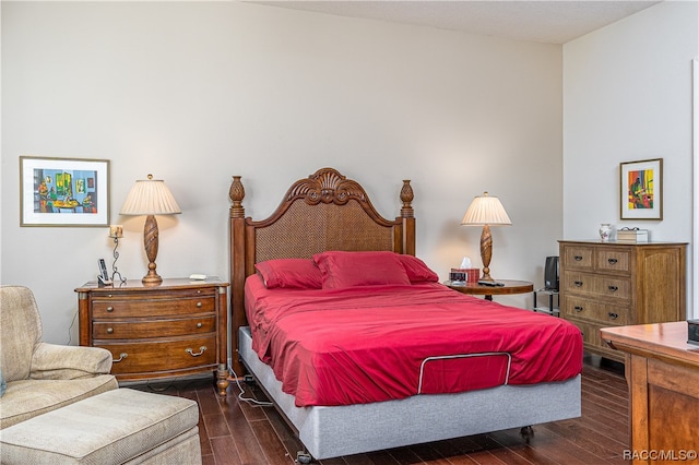 bedroom featuring dark hardwood / wood-style flooring