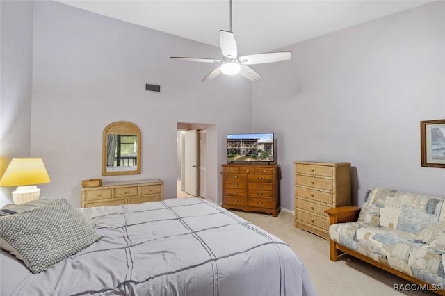 carpeted bedroom with high vaulted ceiling and ceiling fan