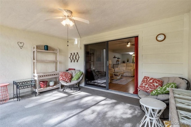 view of patio featuring ceiling fan