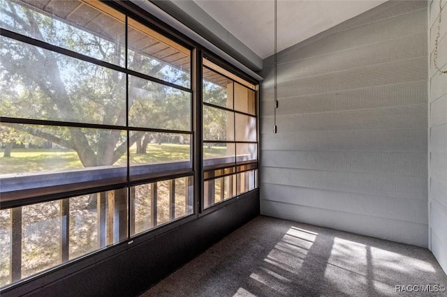 unfurnished sunroom with vaulted ceiling