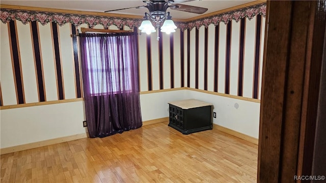 unfurnished room featuring light hardwood / wood-style flooring and ceiling fan