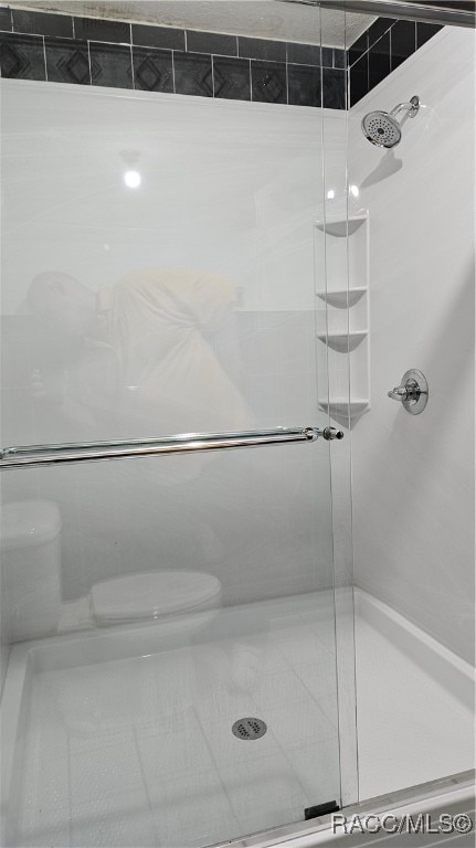 bathroom featuring walk in shower