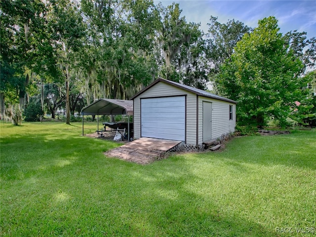 garage with a yard and a carport