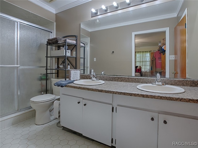 bathroom featuring vanity, tile patterned floors, toilet, ornamental molding, and walk in shower