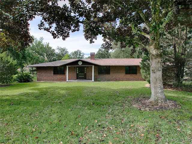 ranch-style house featuring a front lawn