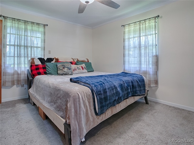 bedroom featuring carpet, ceiling fan, and ornamental molding