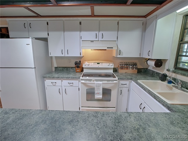 kitchen with white appliances, white cabinetry, and sink