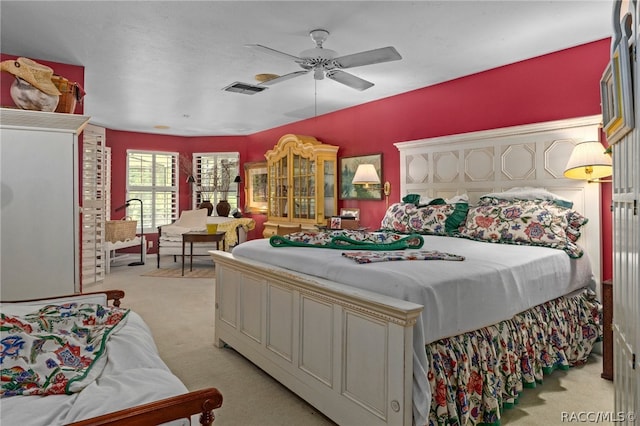 bedroom with light colored carpet and ceiling fan