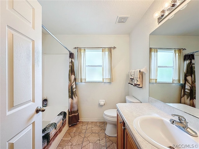 full bathroom with shower / bath combination with curtain, vanity, toilet, and plenty of natural light