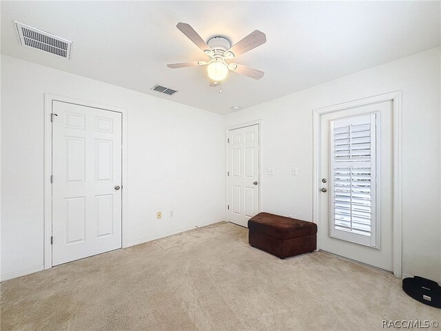 interior space featuring ceiling fan