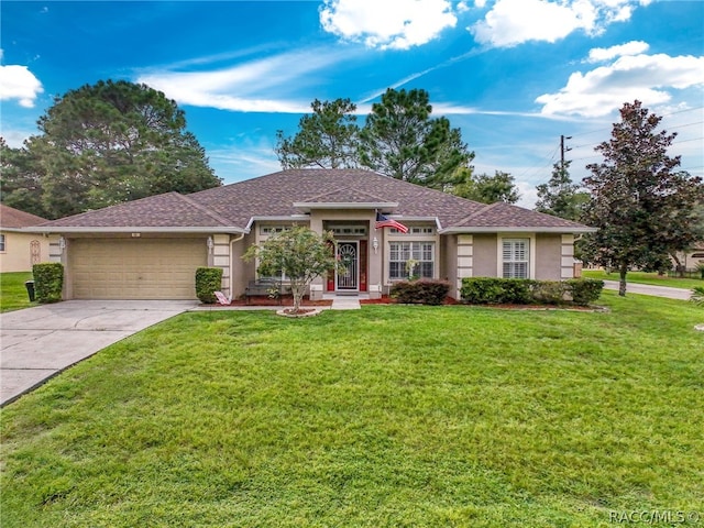 ranch-style house with a garage and a front lawn