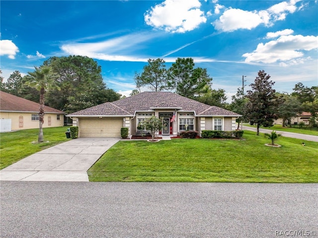 single story home featuring a garage and a front lawn